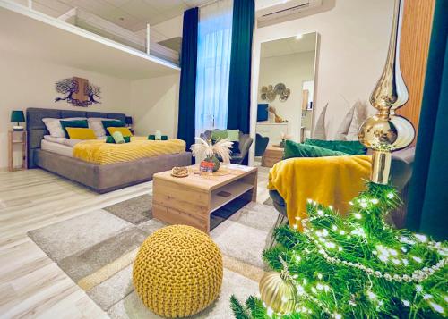 a living room with a christmas tree and a couch at Cuddle Corner Budapest in Budapest