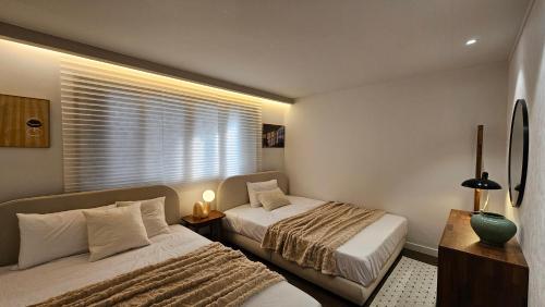 Ένα ή περισσότερα κρεβάτια σε δωμάτιο στο 미미스테이 1st