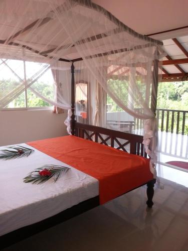 Postel nebo postele na pokoji v ubytování Villa Jungle Paradise