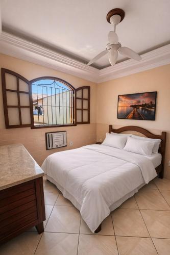 En eller flere senge i et værelse på Casa Entre o Mar e a Lagoa