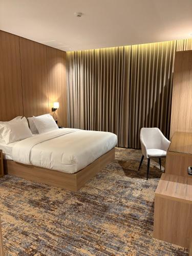 En eller flere senge i et værelse på فندق لايفان LYvAN HOTEL