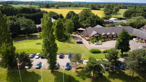 an aerial view of a parking lot at a resort at Draycote Hotel And Whitefields Golf Course in Rugby