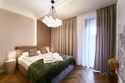 En eller flere senge i et værelse på Polanica Park - LAGUNA - PREMIUM LUX 209