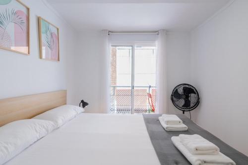 Ένα ή περισσότερα κρεβάτια σε δωμάτιο στο Apartamento Completo junto playa y Centro Bcn