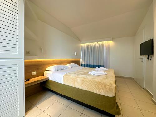 Ліжко або ліжка в номері Hotel Mavridis