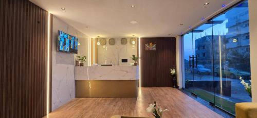 a lobby with a reception desk in a building at Hotel Airport Transit in Bengaluru