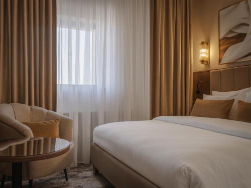 Postel nebo postele na pokoji v ubytování Kazakhstan Hotel