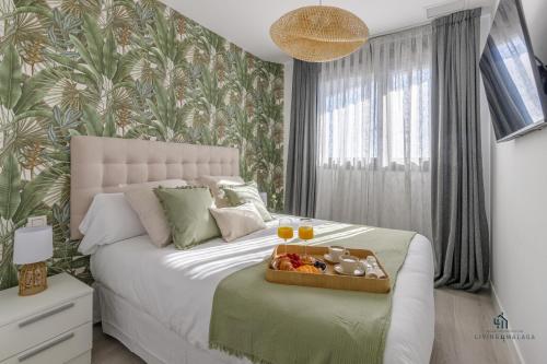 En eller flere senge i et værelse på Living4Malaga Tower Horizon