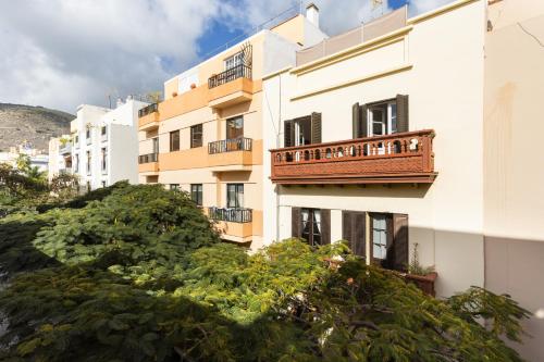 a building with a balcony on the side of it at Home2Book Pensión Casablanca in Santa Cruz de Tenerife