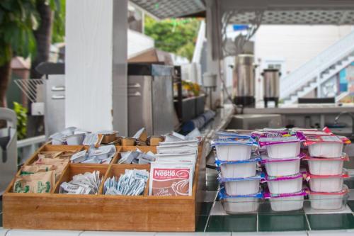 a table with containers of food on a counter at The Palms Hotel in Key West