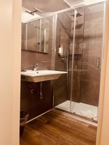 a bathroom with a sink and a shower at Gatto Bianco Carulli in Bari