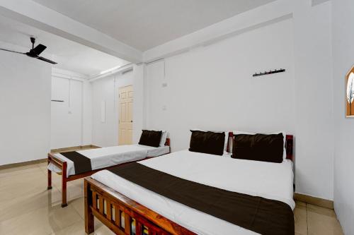 Ένα ή περισσότερα κρεβάτια σε δωμάτιο στο Hotel O HEAVEN REGENCY