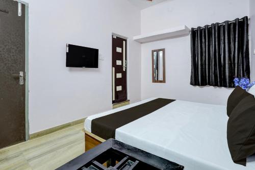 Ένα ή περισσότερα κρεβάτια σε δωμάτιο στο Hotel O by OYO Platinum