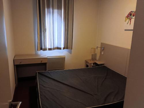 a room with a table with a black sheet on it at Chalets de L Isard D N35 2P6 in Les Angles
