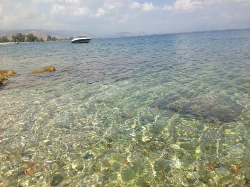 a boat in a large body of water at Linamare Eolos in Kivérion