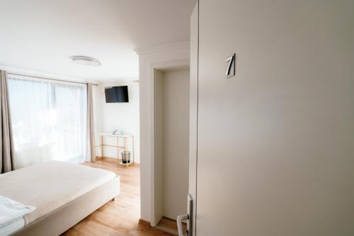 Giường trong phòng chung tại Oana's Guesthouse