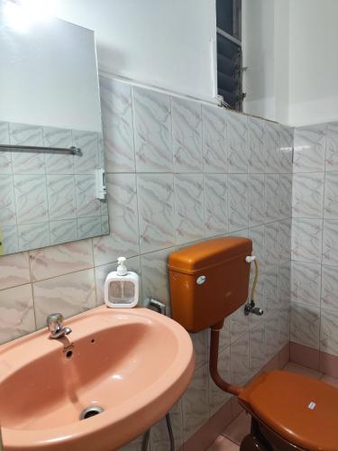 a bathroom with a sink and a toilet at Quiet Coastal Hideaway Studio near Candolim Beach in Candolim