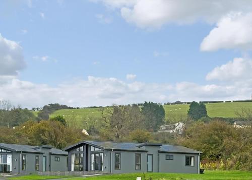 a row of modular homes on a green field at Penally Grange in Tenby
