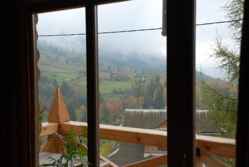 a view from a window of a mountain view at Kraevyd Hotel in Yaremche