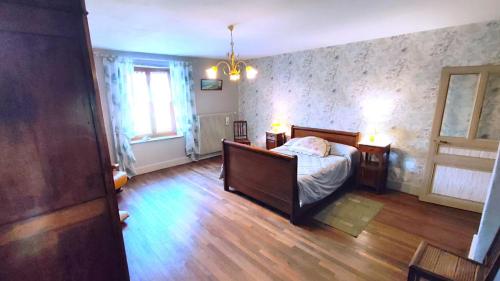 En eller flere senge i et værelse på Chez leontine