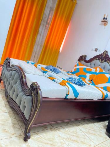 Ένα ή περισσότερα κρεβάτια σε δωμάτιο στο NGK Hôtel Apartment