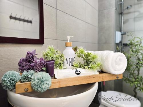 a bathroom with a sink with plants on it at Spacious Cozy Elysia Suite Johor Bahru Legoland in Iskandar Puteri