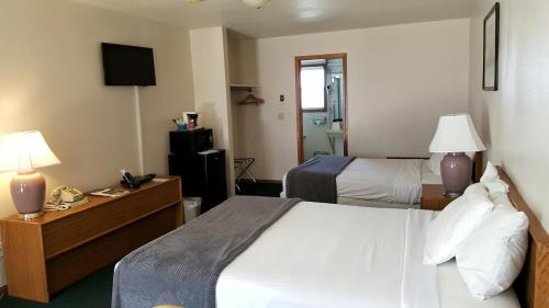Ένα ή περισσότερα κρεβάτια σε δωμάτιο στο Hillcrest Inn