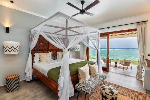 En eller flere senge i et værelse på Delphina