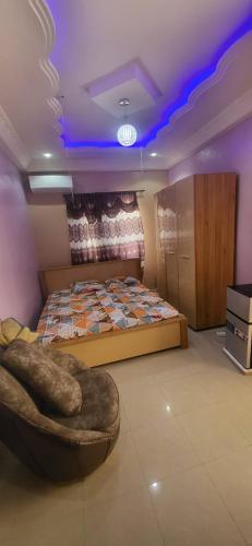 En eller flere senge i et værelse på Chambre climatise