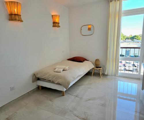 Giường trong phòng chung tại Grand 3 chambres - Bohème chic près du stade