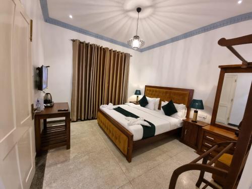 Postel nebo postele na pokoji v ubytování Astoria Cottage