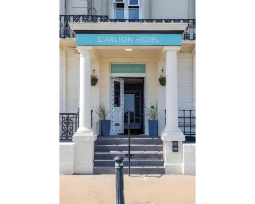 a building with the entrance to the garden hotel at The Carlton Hotel in Great Yarmouth