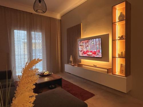 Et tv og/eller underholdning på MaisonCentrale Apartment Downtown