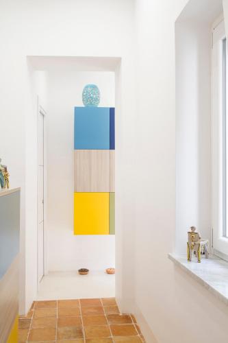 a hallway with a painting on the wall at Il Vicoletto in Amalfi