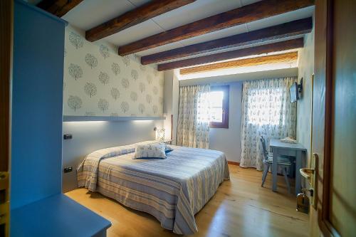 En eller flere senge i et værelse på Agriturismo Roccat