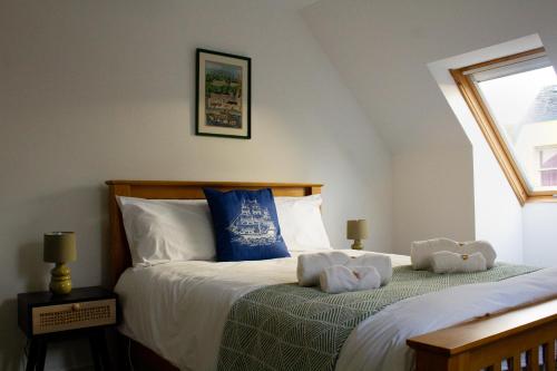 En eller flere senge i et værelse på Littlebay Penthouse