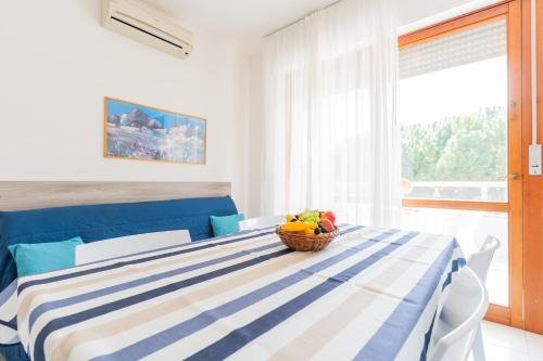 En eller flere senge i et værelse på Residence Le Zattere