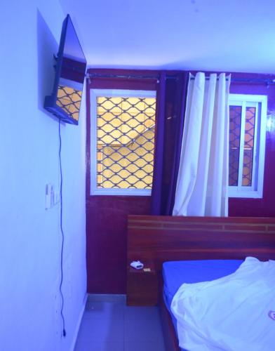 Katil atau katil-katil dalam bilik di Appartements meublés GNB