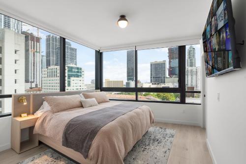 En eller flere senge i et værelse på Luxury City Views in Downtown Miami