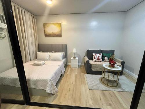 Ένα ή περισσότερα κρεβάτια σε δωμάτιο στο Adings Place at SMDC Cheer Residences