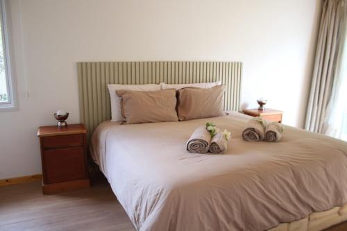 En eller flere senge i et værelse på Family Chalet Boutique