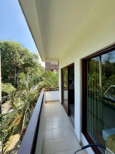 an empty balcony of a house with a view at Hotel Balcones De Malibu in Medellín