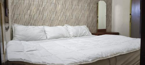 En eller flere senge i et værelse på Nakshatra Cottage