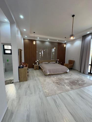 En eller flere senge i et værelse på Acacia Bidiyah