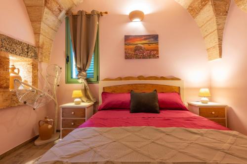 En eller flere senge i et værelse på Villa Renedda