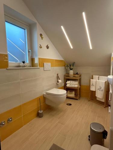 a bathroom with a toilet and a window at La Dimora del Bacchiss in Amalfi