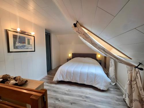 En eller flere senge i et værelse på Clos Leonard