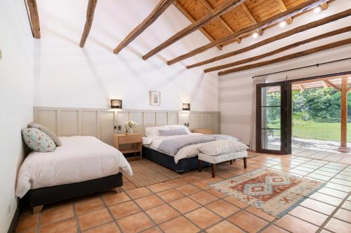 Postel nebo postele na pokoji v ubytování Casona Pirque