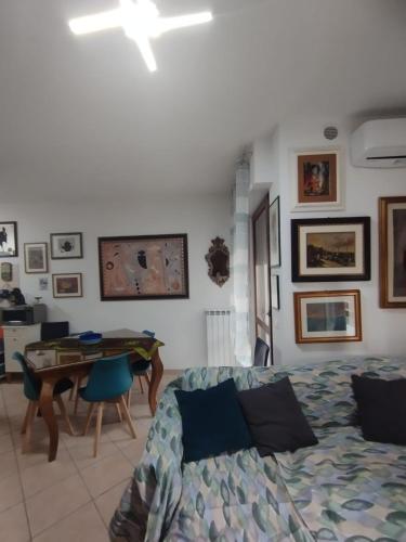 a living room with a couch and a table at Alice in Wonderland in Sutri