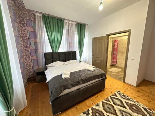 Postel nebo postele na pokoji v ubytování Casa Bunicilor